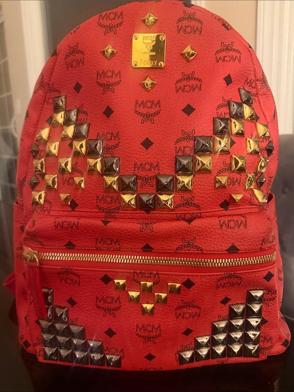 MCM Red Logo Pyramid Stud Backpack with Gold & Silver Accents